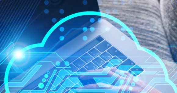 Laptop on a wooden table with cloud graphics