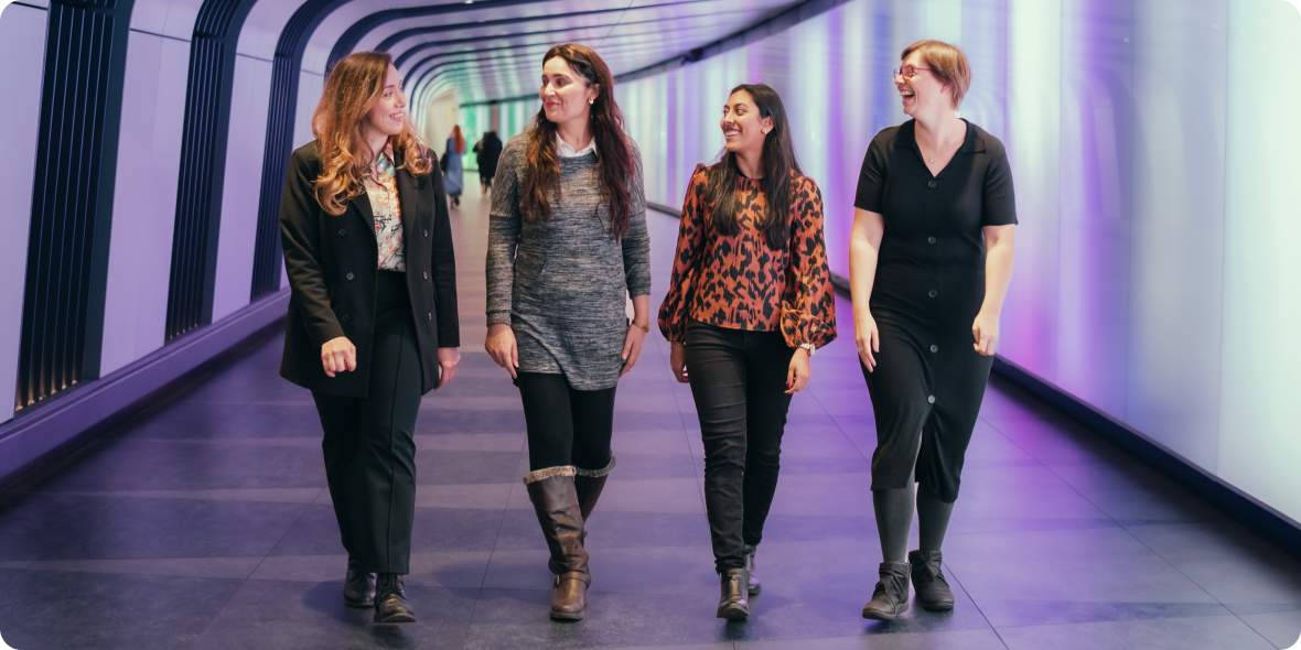 Colleagues talking and walking